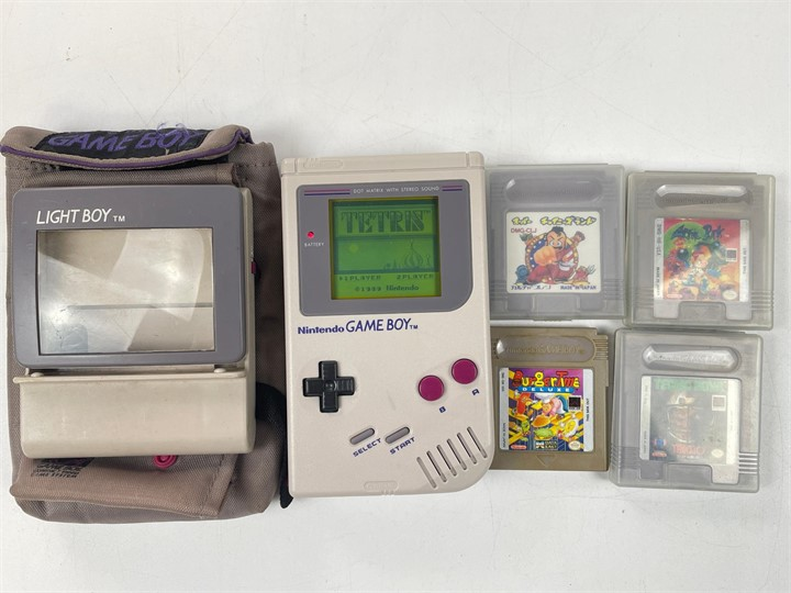 Nintendo Game Boy with games and Light Boy accessory